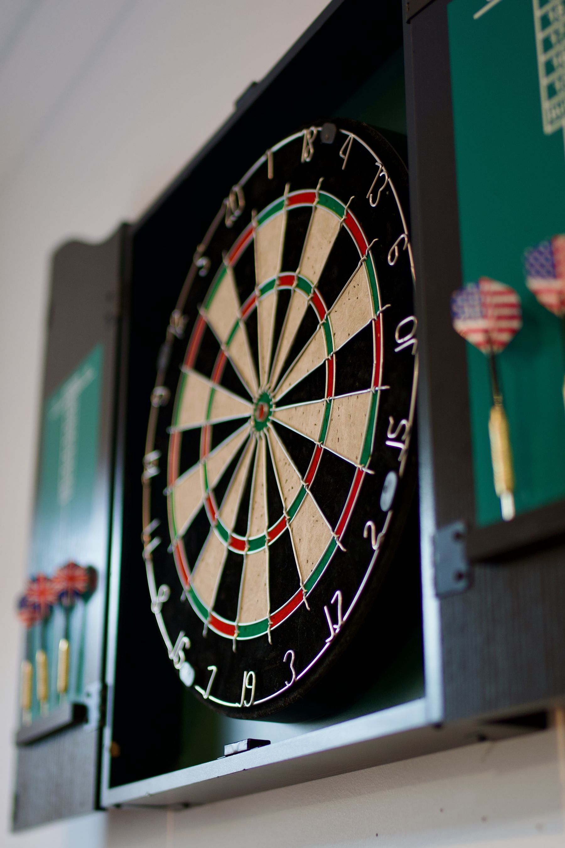Dartboard cabinet in the games room