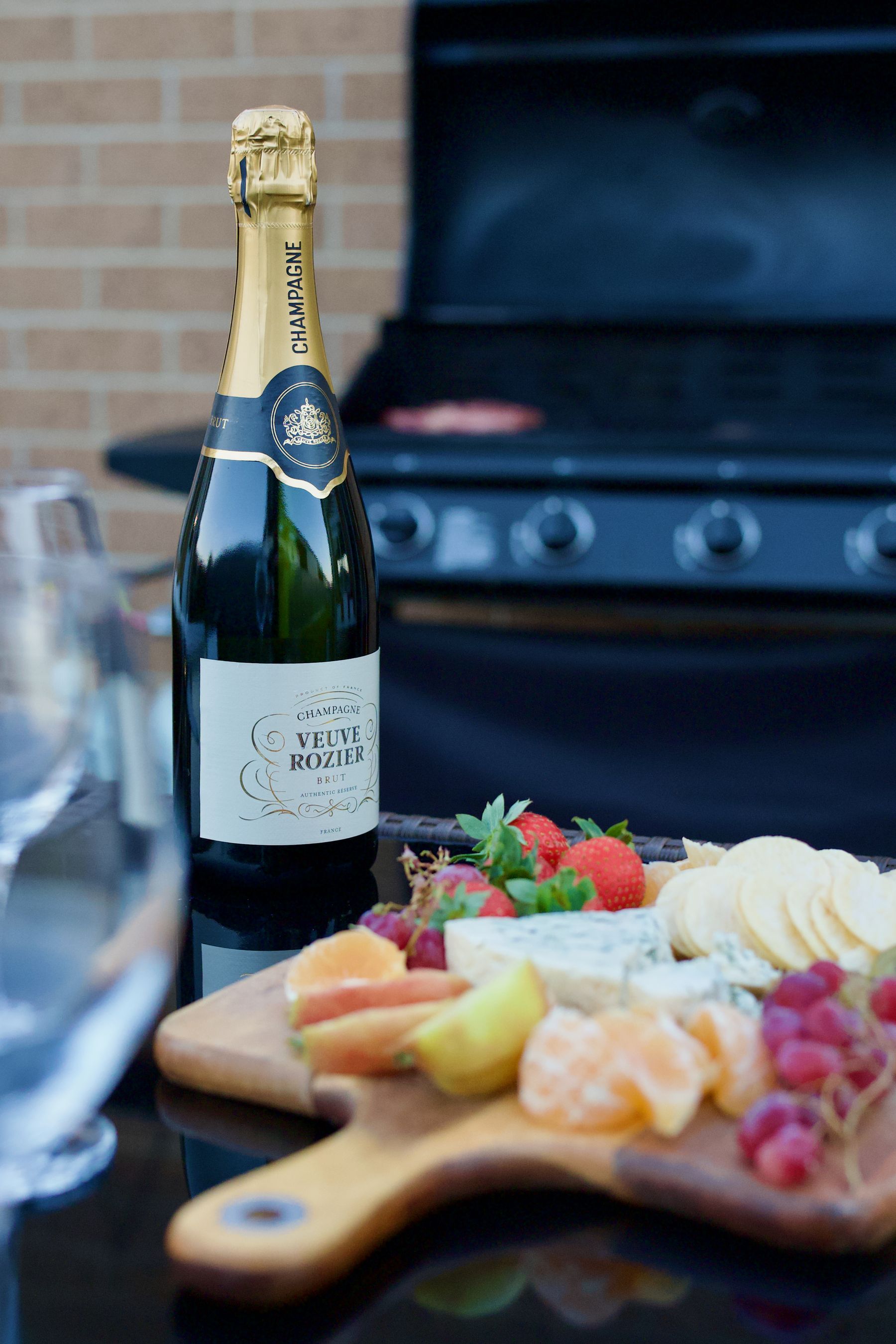 Champagne beside the barbecue in the evening light
