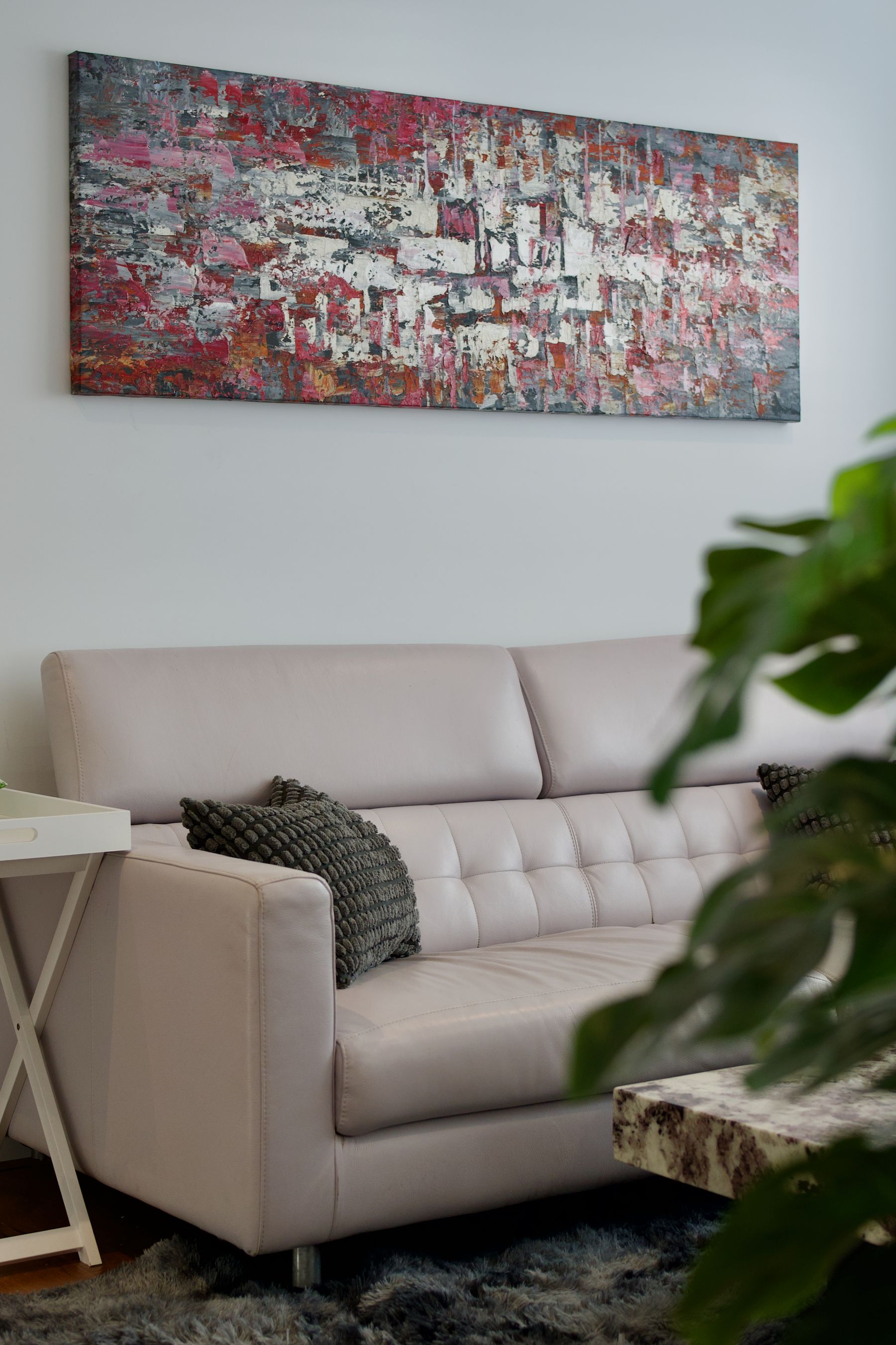 Living room with a soft pink sofa