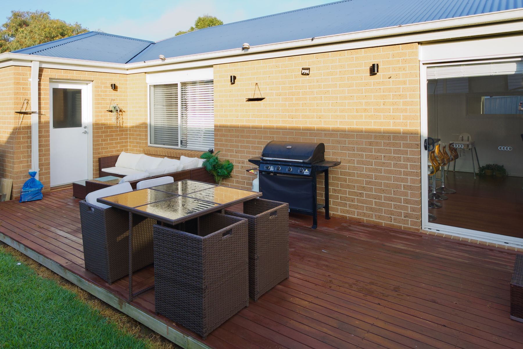 Back deck with barbecue and outdoor lounge setting